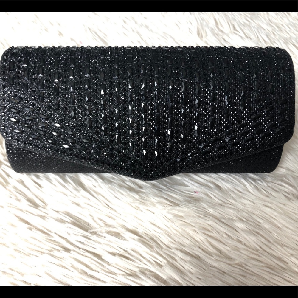 Black studded clutch with strap